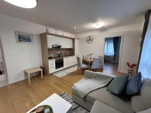 a living room with a couch and a dining room at Thyke Apartment in Krapinske Toplice