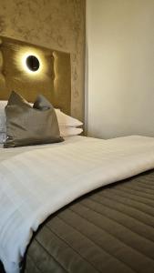 A bed or beds in a room at Penzion Nevada
