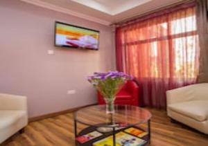 TV a/nebo společenská místnost v ubytování Eseriani The Hotel
