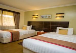 Postel nebo postele na pokoji v ubytování Eseriani The Hotel + 29 fotografií