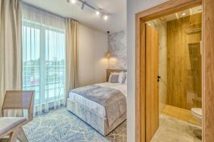 Postel nebo postele na pokoji v ubytování Hotel Serenity Timisoara