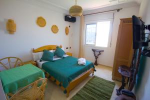 Letto o letti in una camera di Hotel Meftah Chaouen