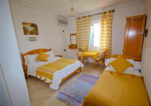 Letto o letti in una camera di Hotel Meftah Chaouen