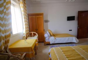 Letto o letti in una camera di Hotel Meftah Chaouen