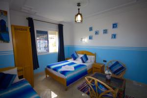 Letto o letti in una camera di Hotel Meftah Chaouen