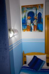 Letto o letti in una camera di Hotel Meftah Chaouen