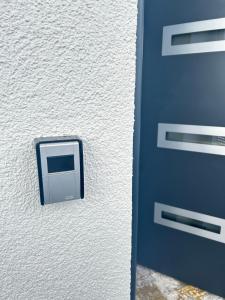 a door with a computer on the side of it at Apart das Ehrets in Bretzfeld