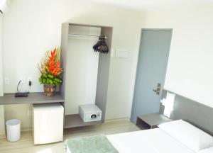 Postel nebo postele na pokoji v ubytování Pajuçara Hotel Express