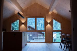 a kitchen with a large window in a house at Haus Kanabe in Schoppernau
