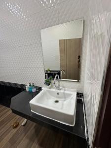 a bathroom with a white sink and a mirror at Luxury Private Pool Villa- Ao Nang Krabi in Ao Nam Mao +37 photos