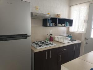 Kuchyň nebo kuchyňský kout v ubytování Casa Vacacional en Ciudad de Cancun