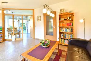 a living room with a couch and a coffee table at Lee in Zingst