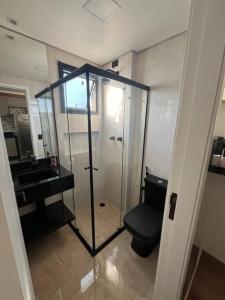 a bathroom with a shower and a toilet and a sink at Apt próximo do metrô carrão in Sao Paulo