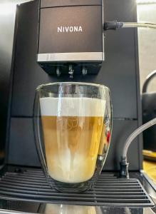 a coffee maker is making a cup of coffee at BaSoTo in Sopot