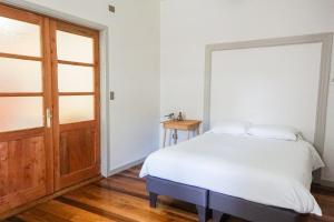 Ένα ή περισσότερα κρεβάτια σε δωμάτιο στο Estudio a orilla de Rio