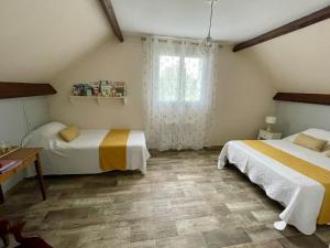 Postel nebo postele na pokoji v ubytování Au Nom des Dames, Maison et Table d'Hôtes, près de Chenonceau et du Zoo de Beauval