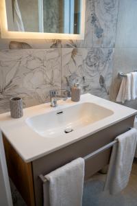 a bathroom with a sink and a mirror at Freedom in SantʼAntonio Abate