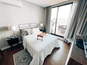 Ένα ή περισσότερα κρεβάτια σε δωμάτιο στο Casa Alpes