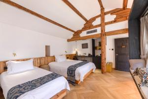 Voodi või voodid majutusasutuse Infini House toas