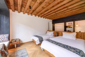 Voodi või voodid majutusasutuse Infini House toas