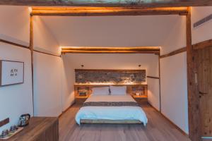Voodi või voodid majutusasutuse Infini House toas