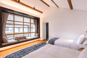 Voodi või voodid majutusasutuse Infini House toas