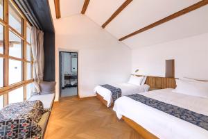 Voodi või voodid majutusasutuse Infini House toas
