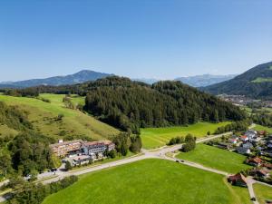 an aerial view of a village in the mountains at Rothenfels Panorama Hotel in Immenstadt im Allgäu