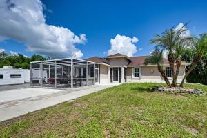 a house with a conservatory in a yard at Fire Table and Home Gym Secluded Naples Home in Naples