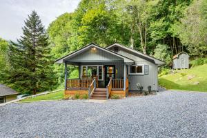 a small house on a gravel driveway at 6 Mi to Waterrock Knob Serenity Cottage in Maggie Valley