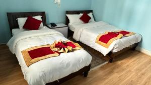 Postel nebo postele na pokoji v ubytování PS Boutique Hotel