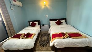 Postel nebo postele na pokoji v ubytování PS Boutique Hotel