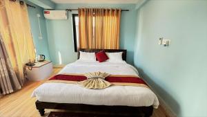 Postel nebo postele na pokoji v ubytování PS Boutique Hotel