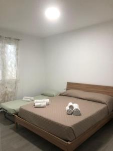 Ένα ή περισσότερα κρεβάτια σε δωμάτιο στο Casa Vacanza Adragna +46 φωτογραφίες