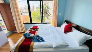 Postel nebo postele na pokoji v ubytování PS Boutique Hotel