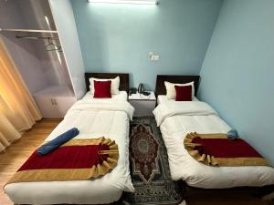 Postel nebo postele na pokoji v ubytování PS Boutique Hotel
