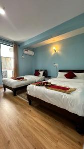 Postel nebo postele na pokoji v ubytování PS Boutique Hotel