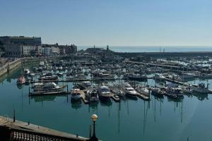 a bunch of boats are docked in a harbor at 2 Bed Georgian cottage, Ramsgate in Ramsgate