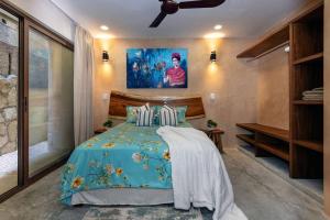 Ένα ή περισσότερα κρεβάτια σε δωμάτιο στο Tanah vikas Luxury 1BD in Aldea Zama Beach Access +17 φωτογραφίες