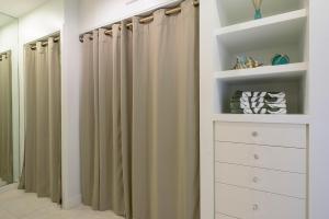 a walk in closet with curtains and a white dresser at Maui Eldorado Condo J206 in Kaanapali +33 photos