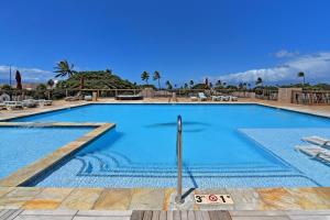 a large swimming pool with blue water in a resort at Maui Eldorado Condo H108 in Kaanapali