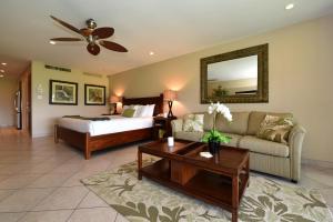 a living room with a couch and a bed at Maui Eldorado Condo J221 in Kaanapali +21 photos