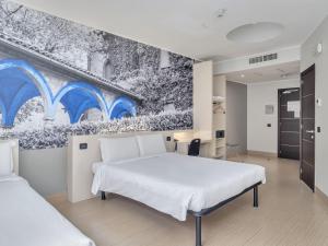 Postel nebo postele na pokoji v ubytování B&B Hotel Como Camerlata