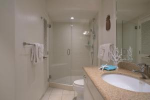 a bathroom with a shower and a sink and a toilet at Maui Eldorado Condo K217 in Kaanapali
