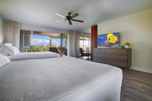 a bedroom with two beds and a ceiling fan at Maui Eldorado Condo A204 in Kaanapali +25 photos