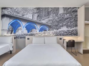 Postel nebo postele na pokoji v ubytování B&B Hotel Como Camerlata