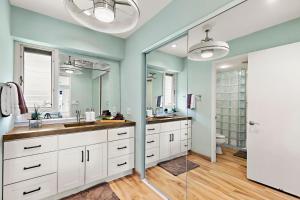 a bathroom with two sinks and a toilet at Maui Eldorado Condo I204 in Kaanapali +33 photos