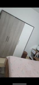a mirror in a room with a table at Basatin targa a giliz in Douar Moulay Hafid