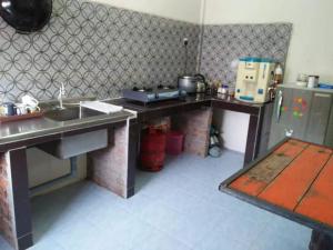 Kuchyň nebo kuchyňský kout v ubytování M4R Homestay Gua Musang