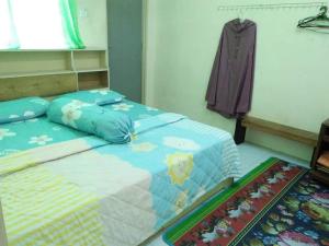 Postel nebo postele na pokoji v ubytování M4R Homestay Gua Musang